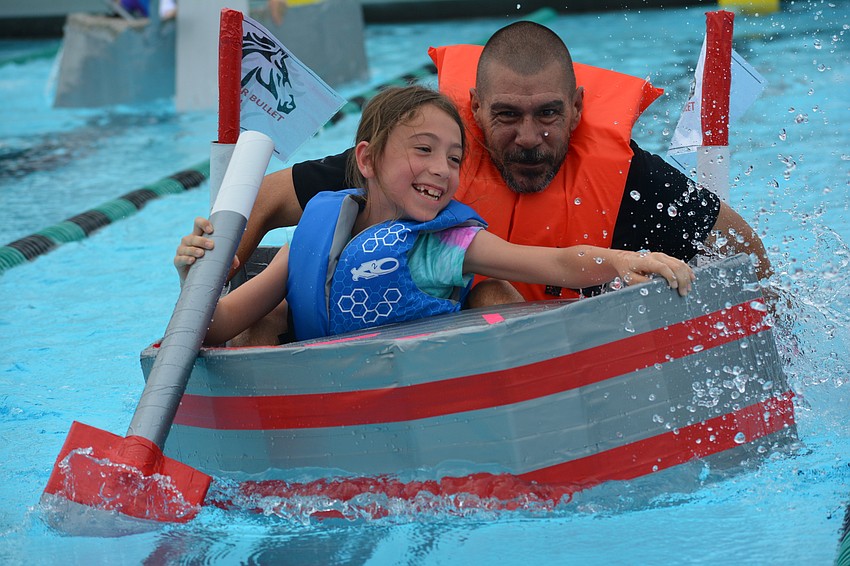 Gullett's Angelina Cerullo enjoys the hard work being done by her dad, Corey Cerullo, during the race.