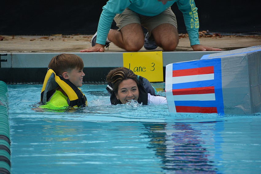 Tara student Nicholas Dieter and his mom, Michelle Dieter, laugh as they find that their boat isn't sea-worthy.