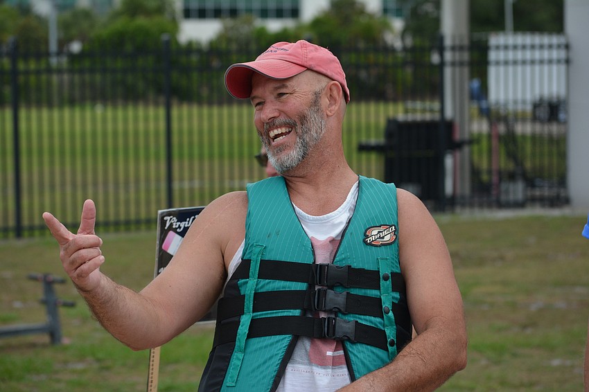 Mills Principal Jim Mennes celebrates his victory in the principals' race.