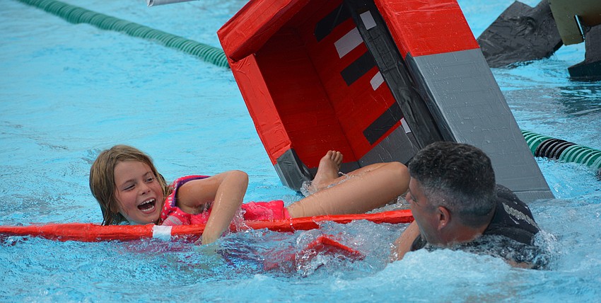 Gullett's Anna and Bora Kayan didn't seem to mind their boat going to the bottom.