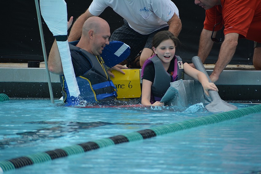 Justin Daley can't keep his boat afloat as his daughter, Tara student Emma Daley, takes her seat.