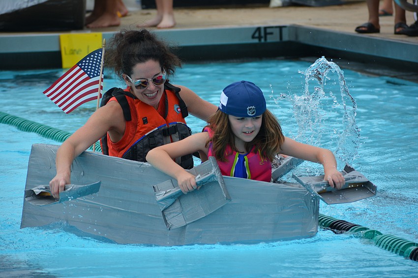Gullett's Caitlyn and Amanda Callihan bring the American flag along for the ride in Heat 8.