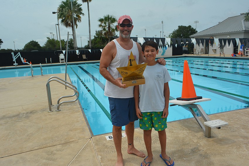 Mills Principal Jim Mennes and his son, Charlie, who designed the boat, won the principals' race.