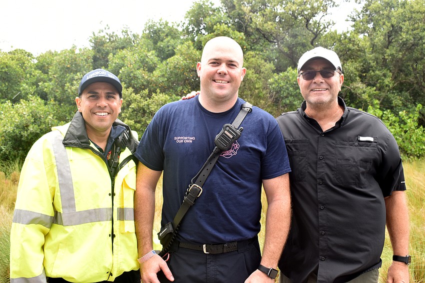 Jose Rivera, Bryan Carr and Town Manager Tom Harmer