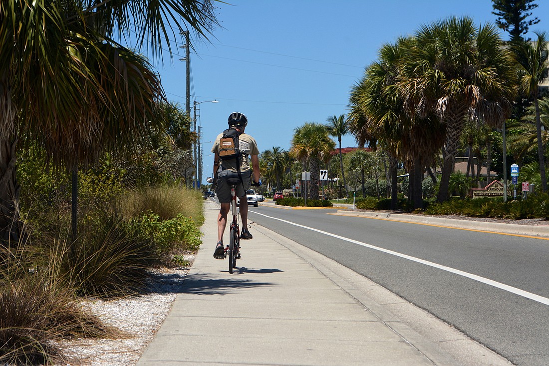 Greg Lintner preferred to side on the sidewalk while riding around Siesta Key.