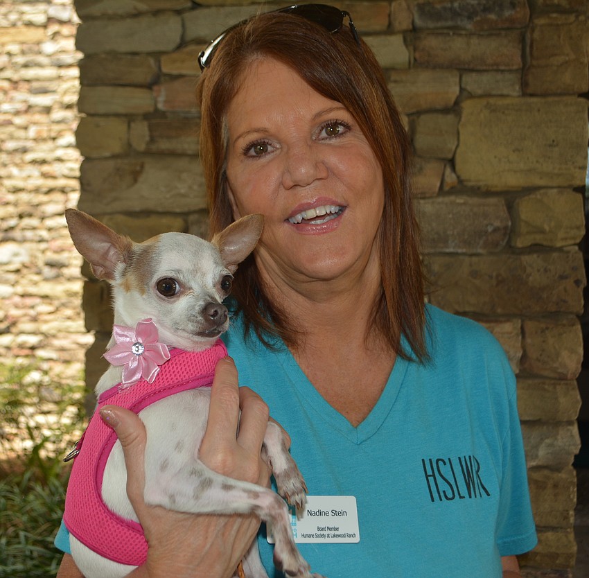 Nadine Stein and rescue dog, Havana, greeted golfers as they checked in at the sixth annual Putts Fore Mutts Scramble.