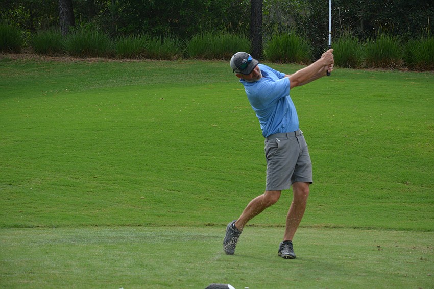 Willis Smith executive Brett Raymaker rips a shot.