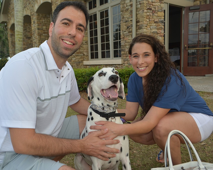 East County's Philip Mobilio and Chistina Bonaccorso show off Vito, a 3-year-old Dalmatian rescue dog after a walk down the red carpet.