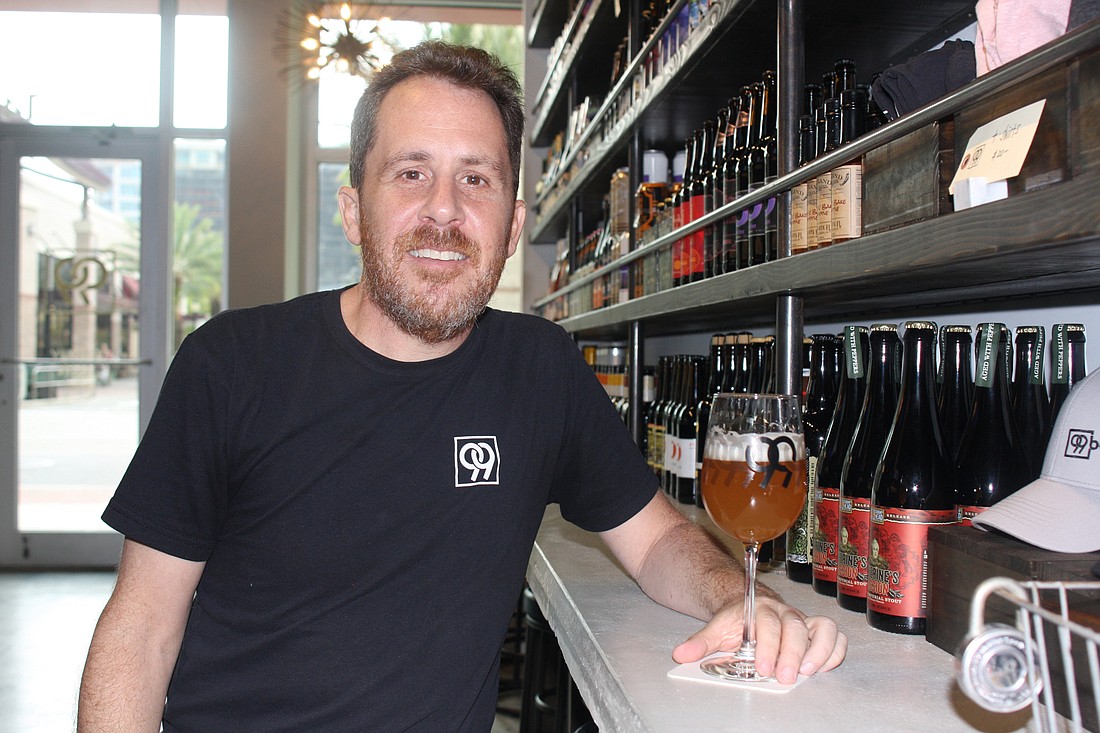 Mark Tuchman, the former proprietor of Mr. Beeryâ€™s, opened 99 Bottles as a cozy, affordable local bar option. Photo by Su Byron