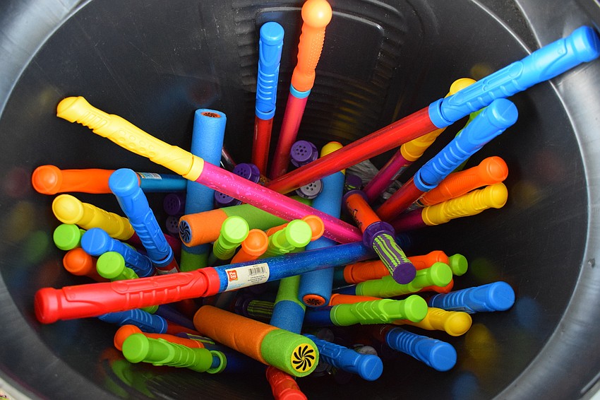 A collection of water cannons were ready for volunteers to pick up and launch at students at a moment's notice.