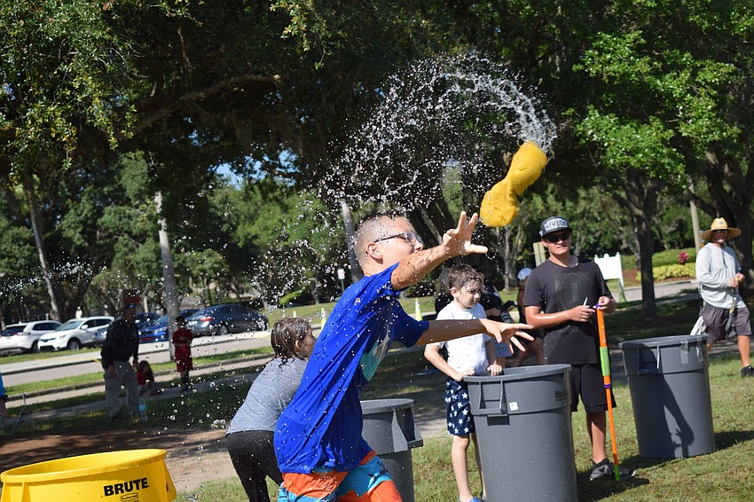 Student Brandin Gallaway whips a sponge during the event.
