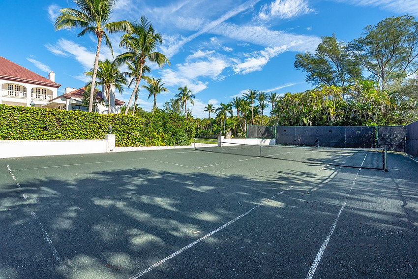 A private tennis court is on the property.