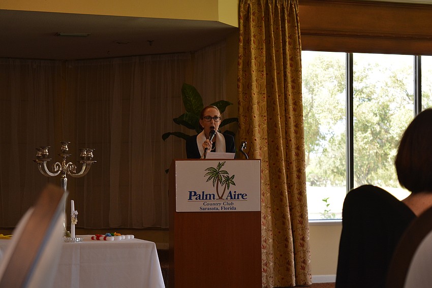 Palm Aire's Susan Romine welcomes guests and says the theme is 