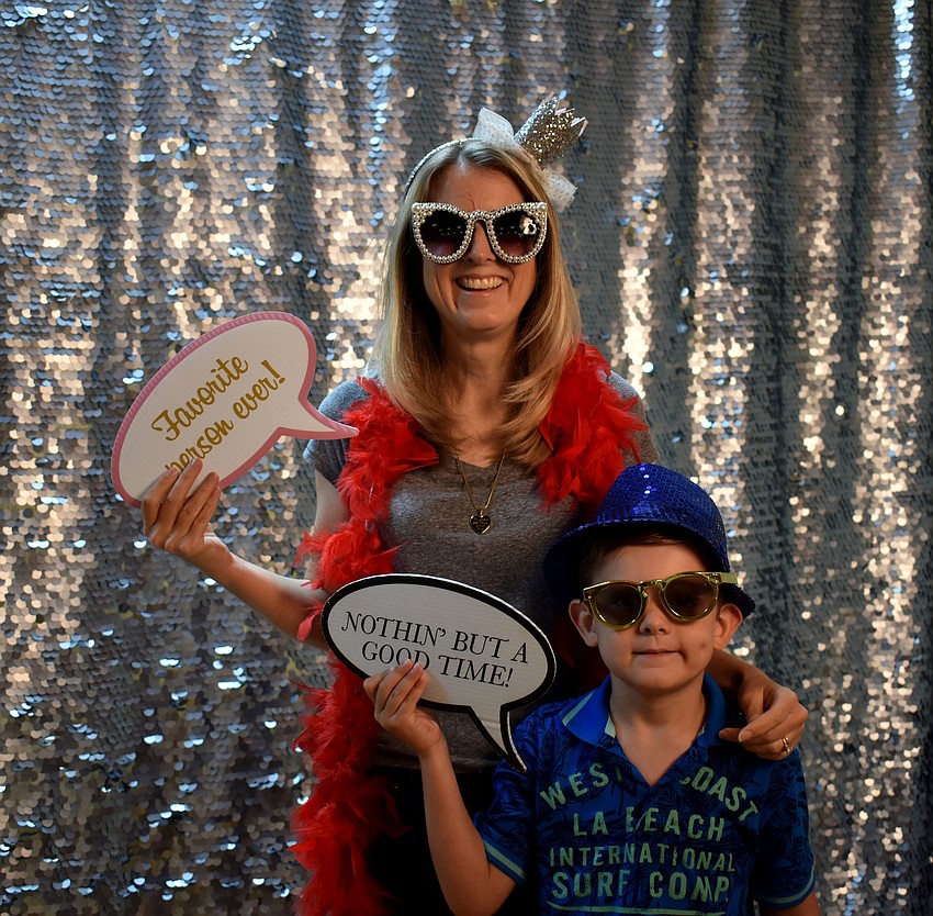 LeAnne and J.D. Loeffel have some fun at the photo booth.