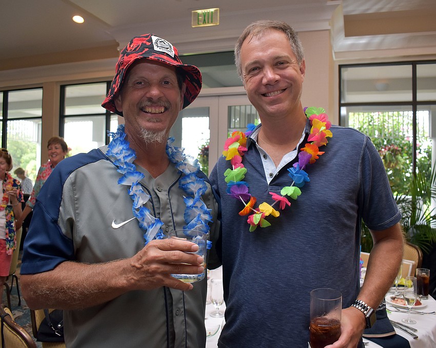 Golf buddies Tim Ruark and Ric Reiter were all smiles at the party.