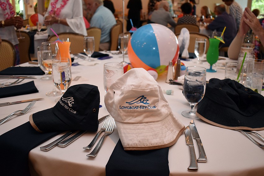 The tables were decorated with beach balls and fishing hats.