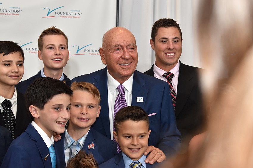 Dick Vitale poses with the pediatric cancer survivors in attendance.