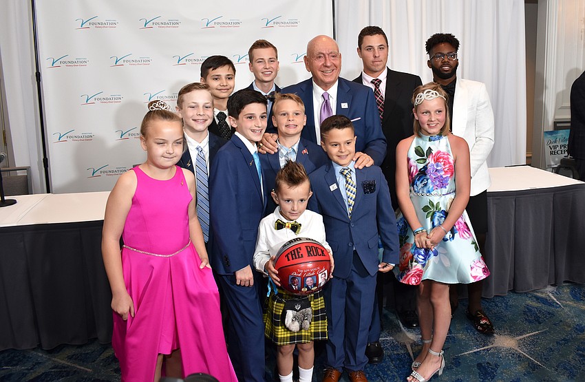 Dick Vitale poses with the pediatric cancer survivors in attendance.