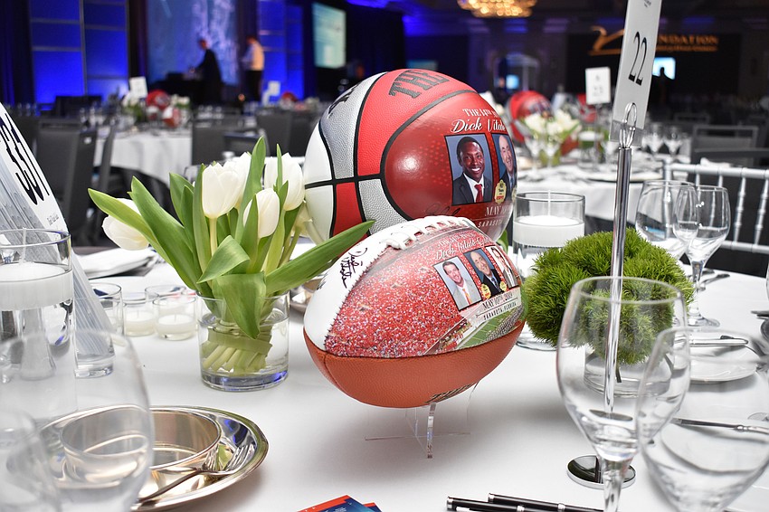 Every table was decorated with tulips and a football and basketball showcasing the honorees.