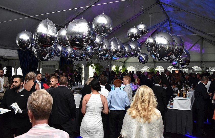 The VIP reception was held in a tent — that took in a little water from the storm — outside the hotel.