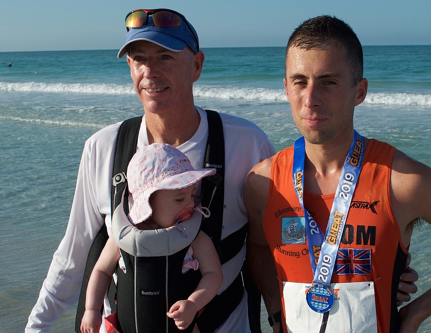 Tom Sirett celebrated his men's division victory with John Sirett and Sophie.