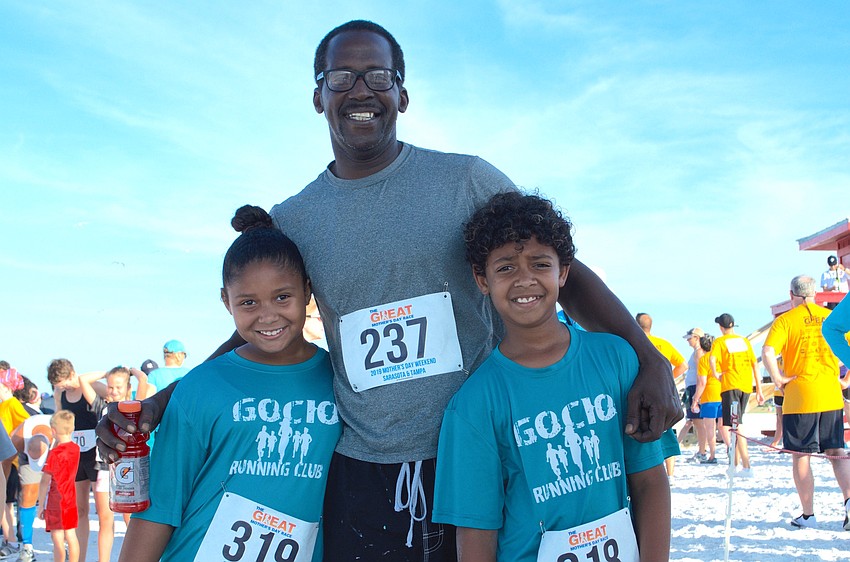 Victor Lee was ready to run at the starting line with Jasmine Lee, left, and Victor Lee. Young Victor recently joined the 100-Mile Club with the Gocio Elementary School Running Club.