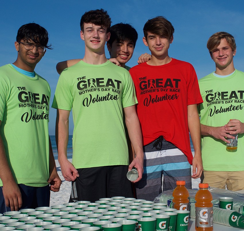 Ohm Patel, left, Jovany Perez, Liam Antoszewski, Jeb King and Grant Hill were volunteering at the water table. They are members of the Braden River High Key Club.