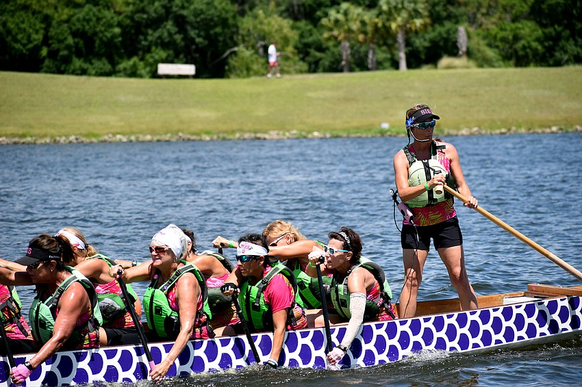 Survivors in Sync captain Angela Long steers her team's boat.