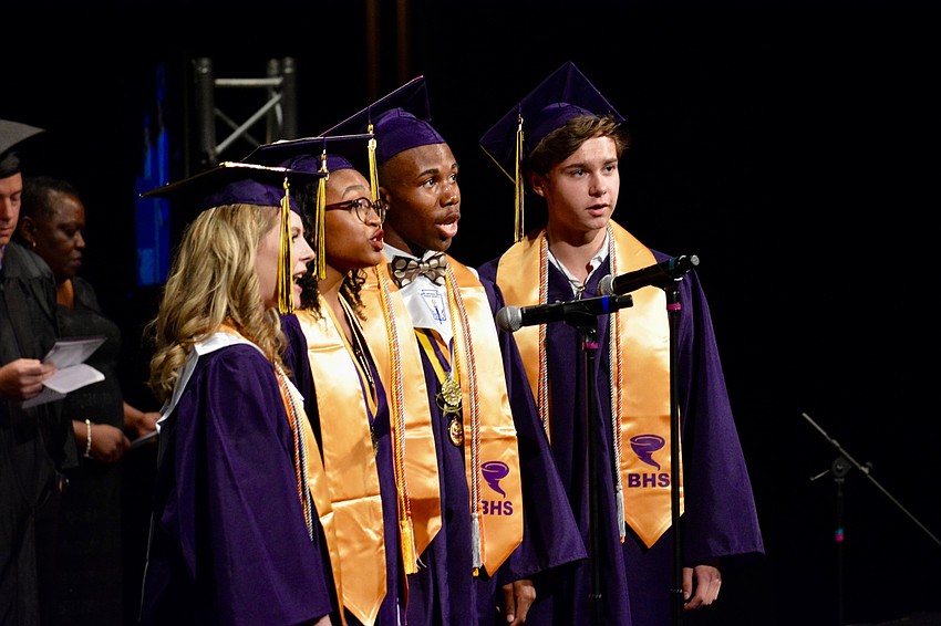 Taylor Reister, Maicy Powell, Jatavian Peterson and Jonah Duchesne-Shaw sing the Booker High alma mater