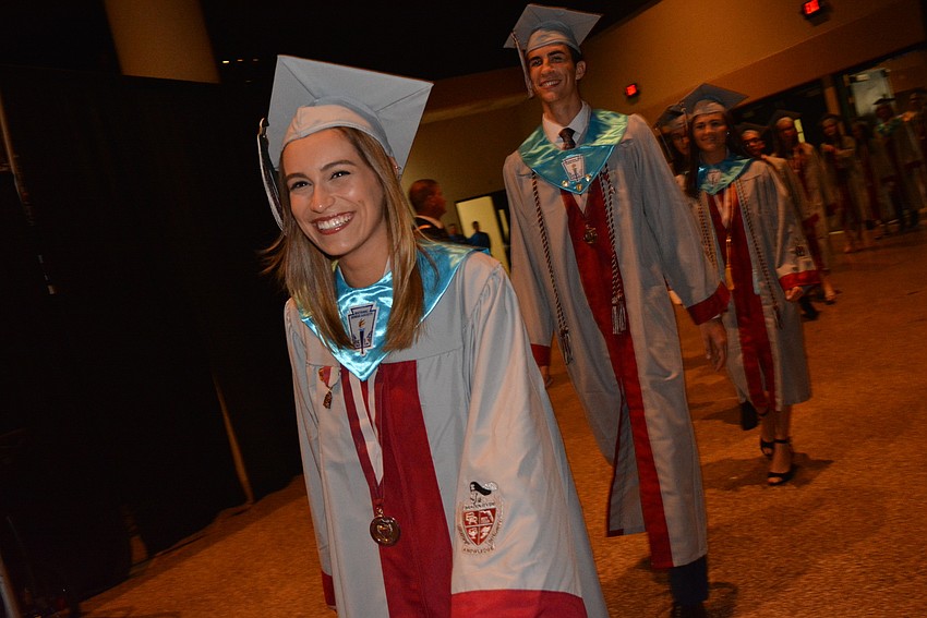 Francesca Aluise is all smiles and she walks into the auditorium and sees all the families  cheering for their graduates.