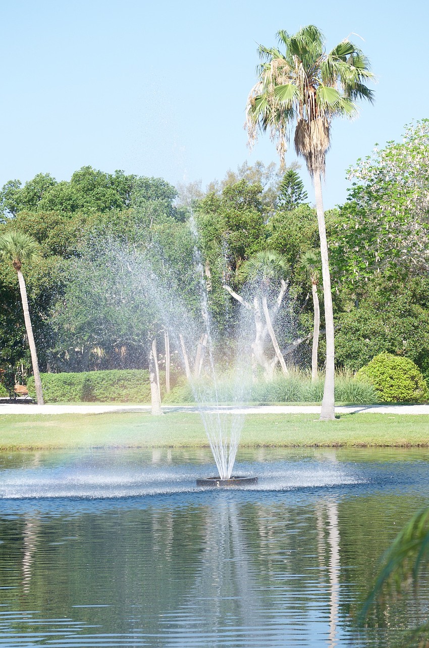 A pond and fountain greet visitors.