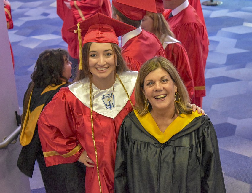 English teacher Jan McGovlen (right) has walked in 40 graduations with Cardinal Mooney Catholic High School and will retire this year.