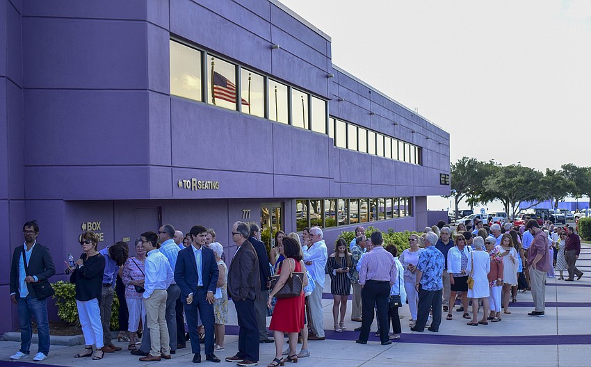The friends and family of the graduates lined up around the Van Wezel as they waited to be let inside.