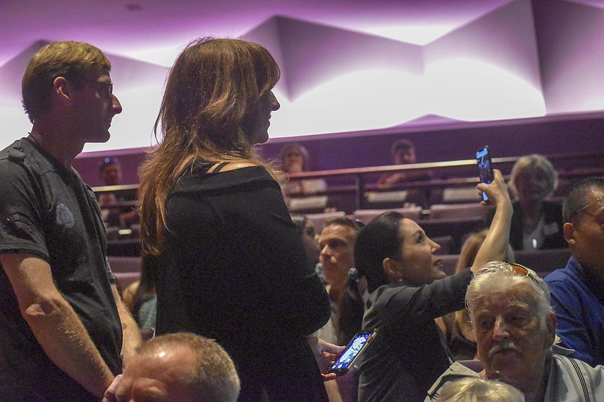 Friends and family snapped photos of the graduates as they filled into the theater.