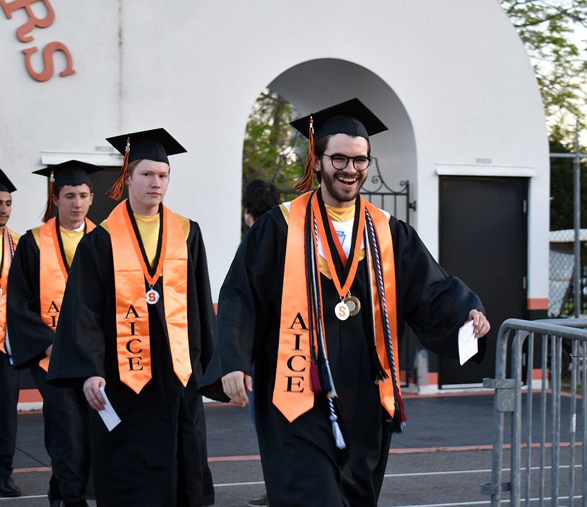 One graduate couldn't help but smile as he entered the stadium.
