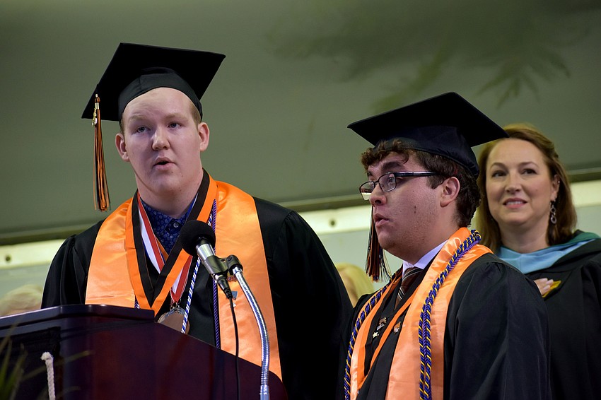 Seniors Keaton Smith and Nicholas Anthony sing the National Anthem.