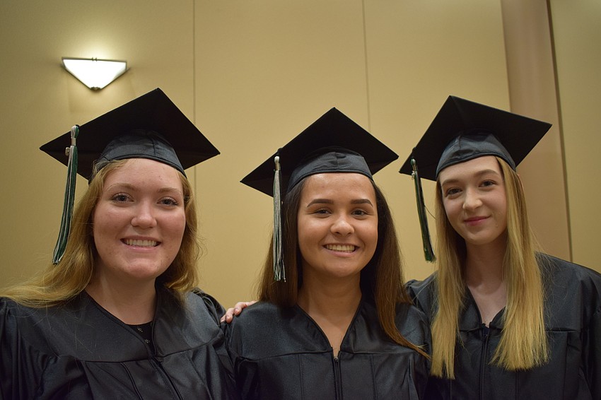 Katie Suba, Stefanie Tucker and Katie Minton await the start of the ceremony.