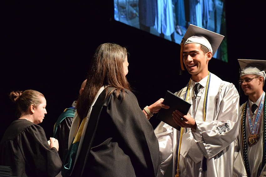 Benjamin Reichbach receives his diploma.