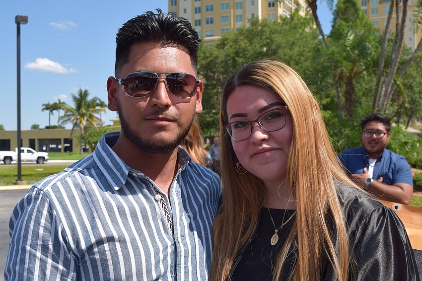Alex Salmeron congratulates his girlfriend, Yazmin Uribe, on her graduation.