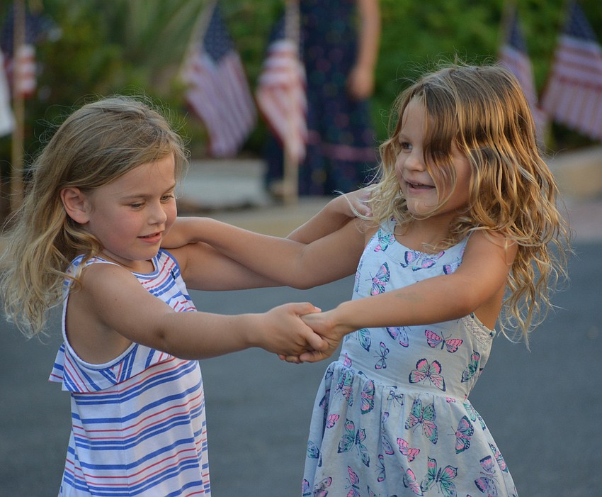 University Place's Ava Gilbank and Lakewood Ranch's Kaelyn Zabikow met just before the parade began but they had time to do a little dancing on Lakewood Main Street.
