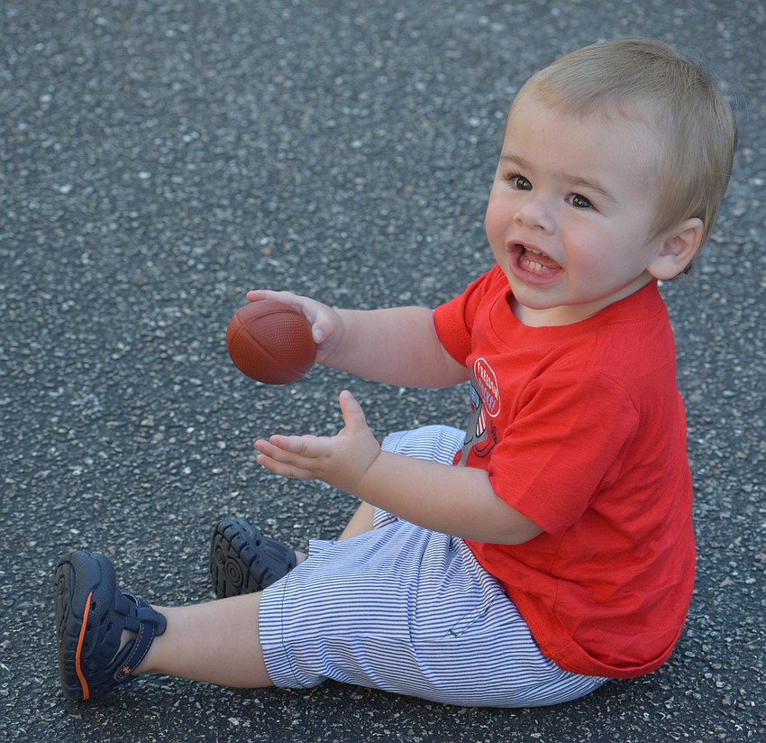 Creekwood 1-year-old Jaxon Barnes is having a ball and the parade hasn't even started.