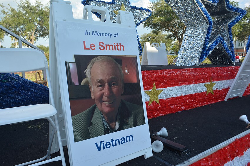 An empty chair was left on a float for the late Le Smith, a Vietnam veteran.