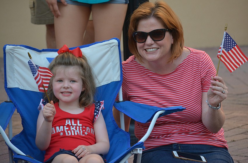 Lakewood Ranch's Mary Anne Poulton and her mom, Tara Poulton, salute the veterans.