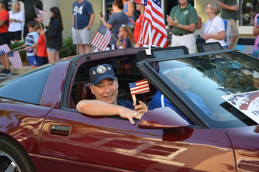 Vietnam veteran Fred Chapman brought his own little American flag to wave.