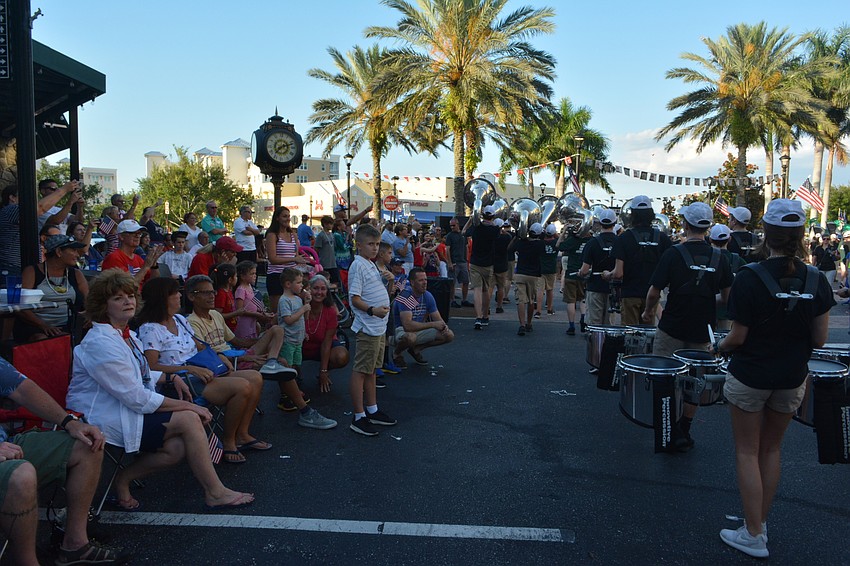 The parade route became a funnel as spectators moved closer to those who marched.
