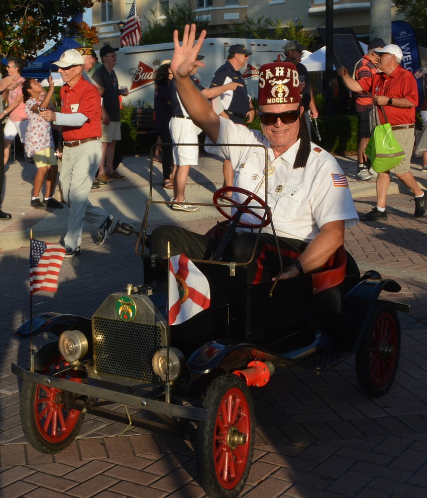 Russ Sexton of the Model T Shriners makes his way through the parade route to the delight of the crowd.