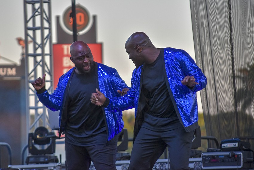 Leon S. Pitts II (left) dances with Sheldon Rhoden.