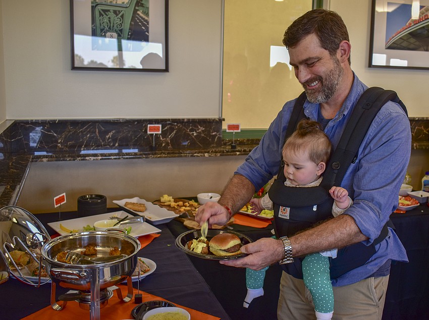 Travis Howard and 6-month-old Piper.