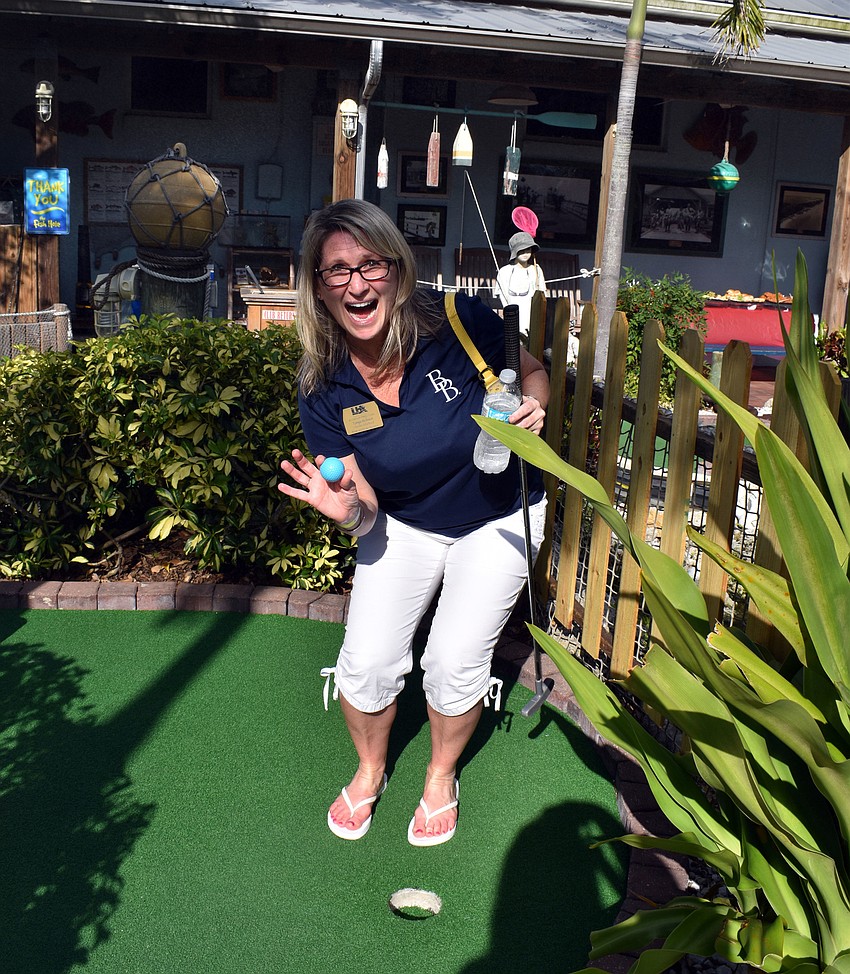 Tonya Atchison celebrates her hole in one.