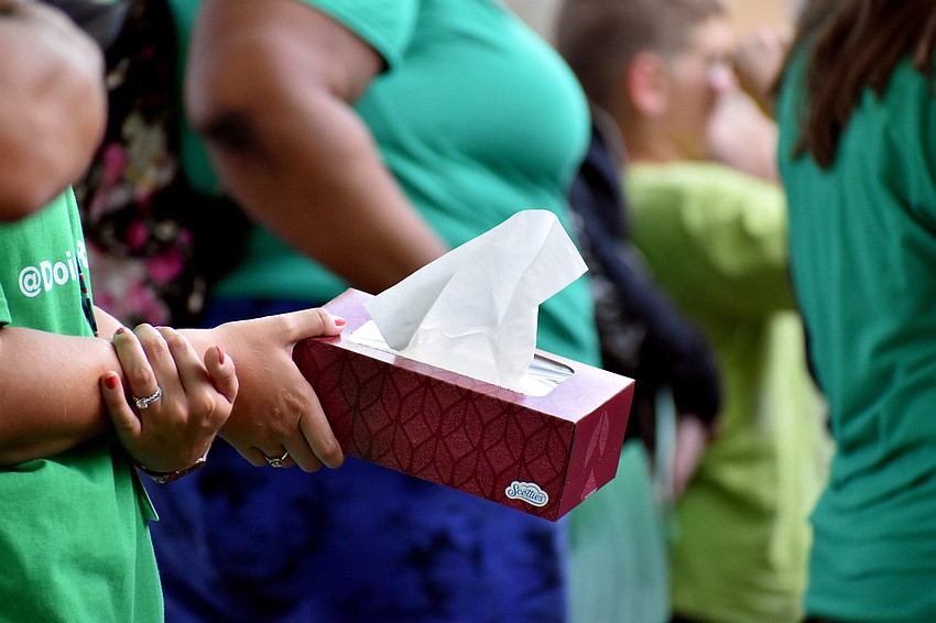 Teachers walked through the crowds with tissue boxes.
